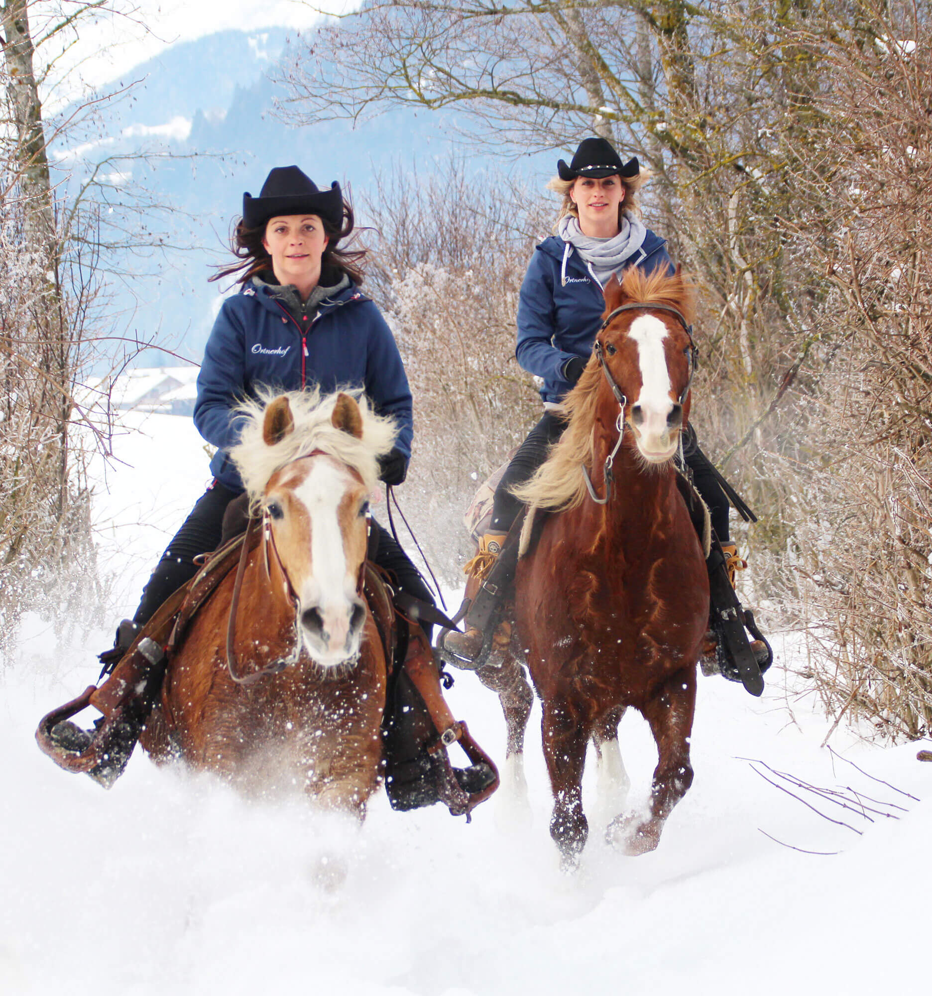 Two women riding through the snow in winter - Hotel Ortnerhof